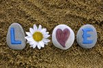 love-spell-out-stones-letters-heart-flower-word-sea-sand-drawn-me-66038492.jpg